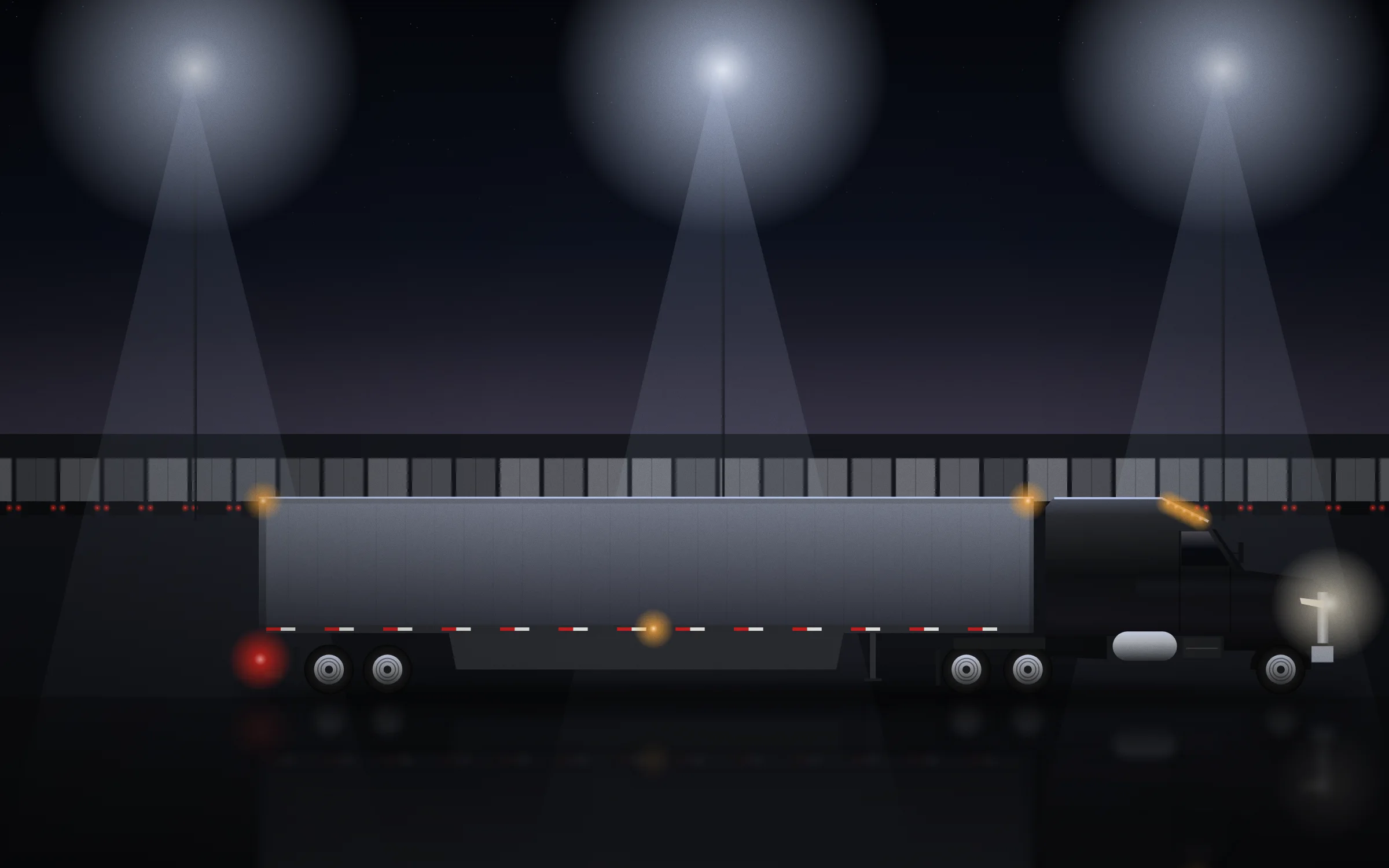 Company tractor and trailer at the Laredo yard at night